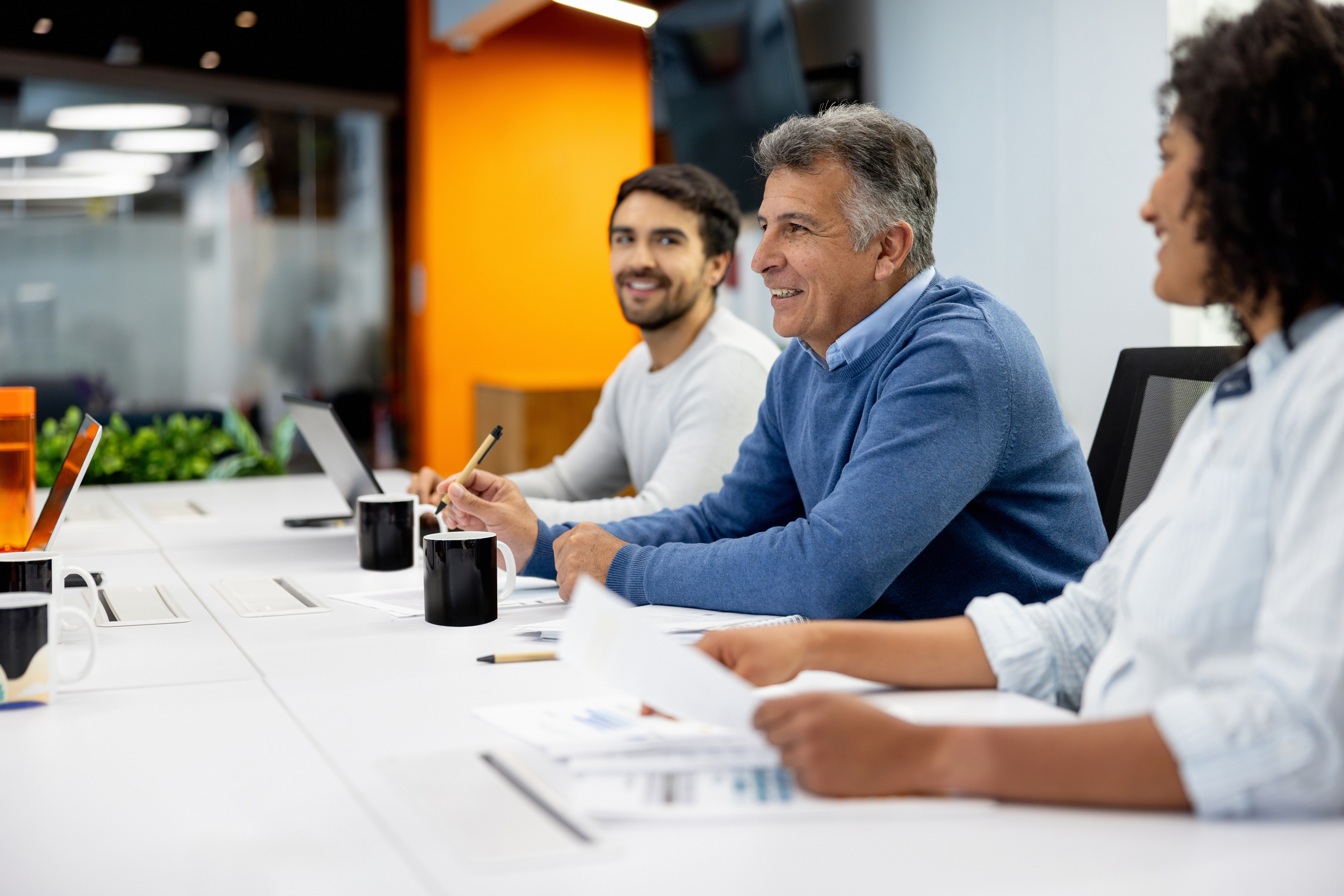 a work meeting taking place at a table
